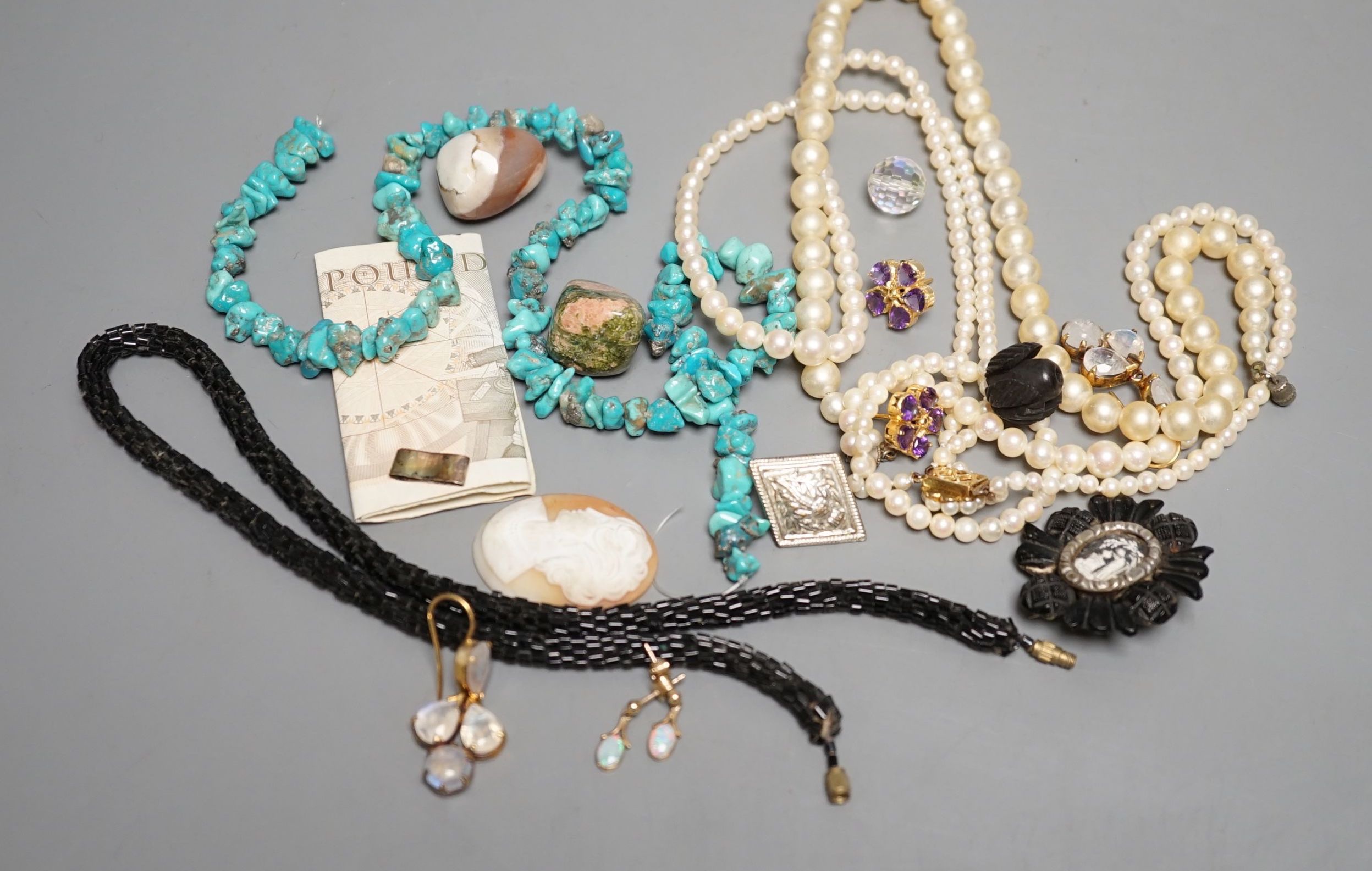 A quantity of costume jewellery including a pair of yellow metal and opal drop earrings.